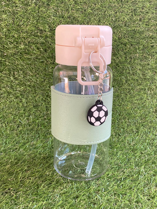 Clear plastic bottle with green sleeve and soccer ball key chain.